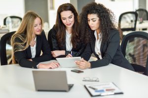 Three Business women working together with requirements for business